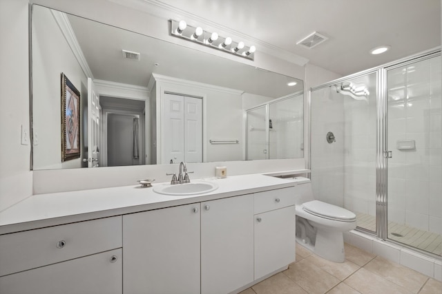 bathroom with vanity, crown molding, a shower with door, and tile patterned floors