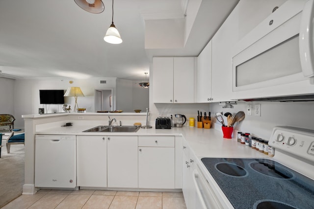 kitchen with decorative light fixtures, white cabinetry, sink, light tile patterned floors, and white appliances