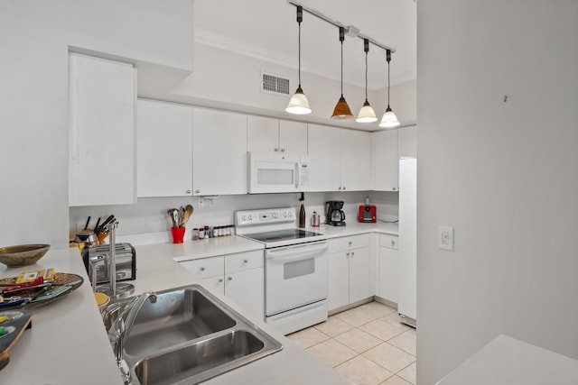 kitchen featuring sink, hanging light fixtures, light tile patterned floors, white appliances, and white cabinets