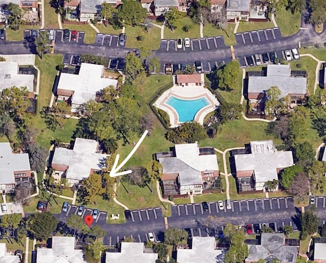 birds eye view of property with a residential view