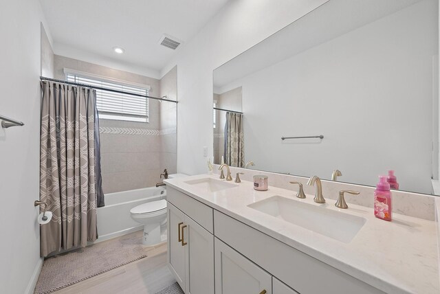 bathroom with toilet, baseboards, and a sink