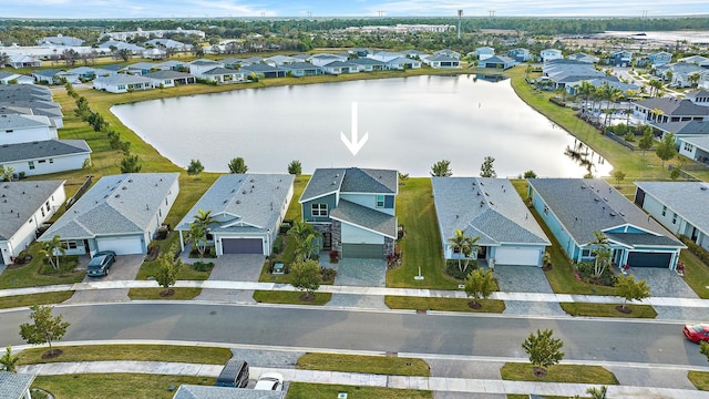 drone / aerial view featuring a water view