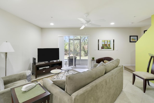 tiled living room featuring ceiling fan