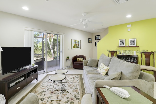 living room featuring ceiling fan and light tile patterned flooring