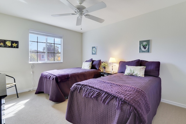 bedroom with light colored carpet and ceiling fan