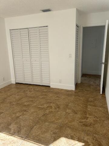 unfurnished bedroom featuring a closet