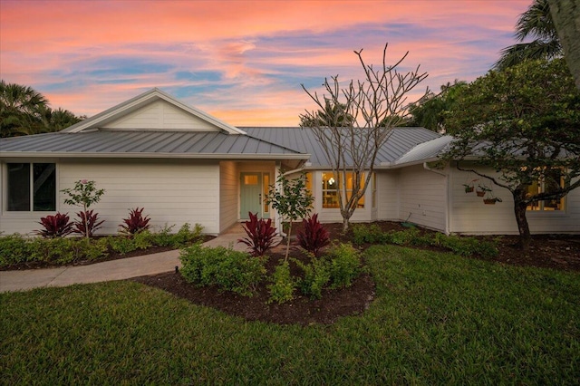 ranch-style house featuring a yard