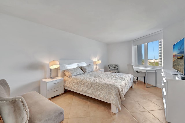 bedroom with light tile patterned floors