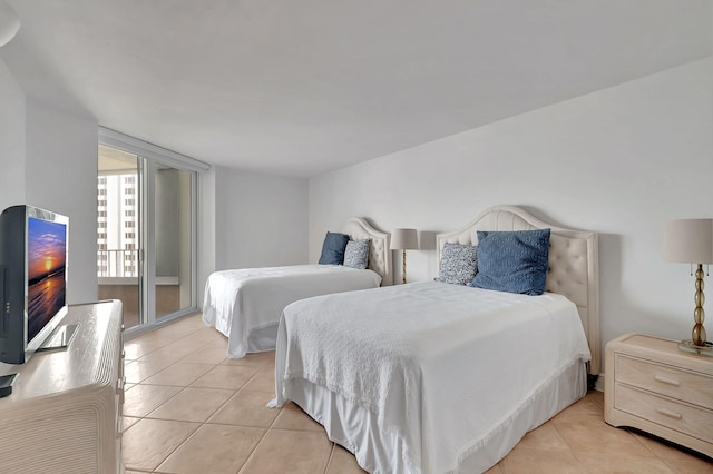 tiled bedroom featuring access to exterior