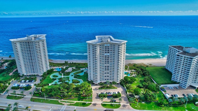 aerial view featuring a view of the beach and a water view