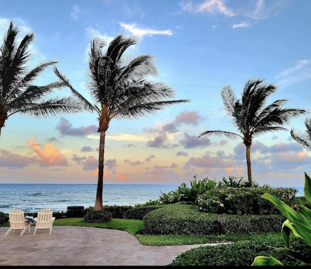 exterior space featuring a patio and a water view