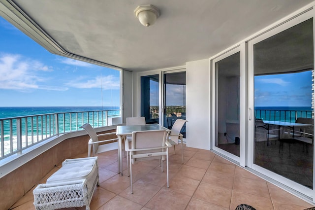 balcony featuring a water view