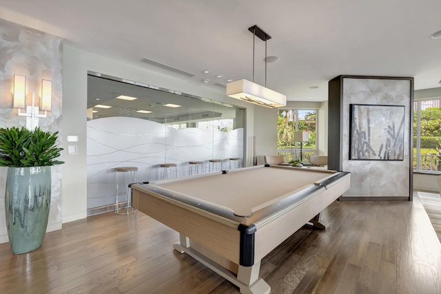 game room with hardwood / wood-style floors and pool table