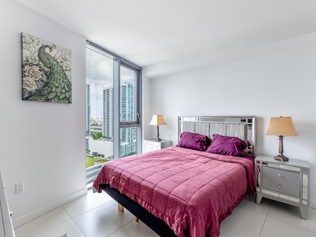 tiled bedroom with expansive windows