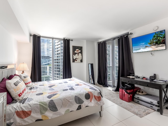 tiled bedroom featuring multiple windows