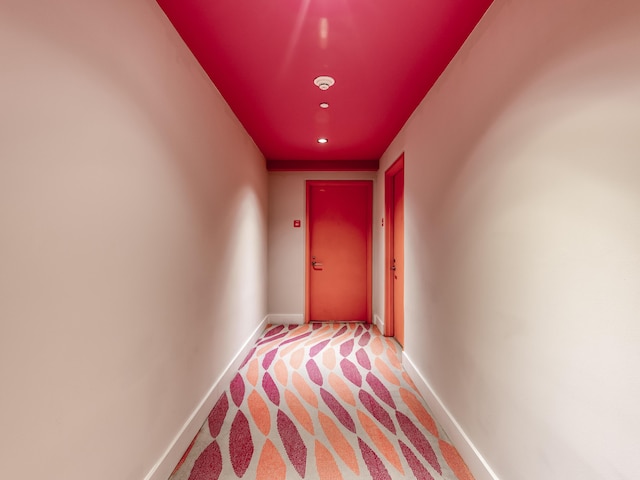 hallway with light carpet