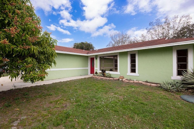 single story home featuring a front yard