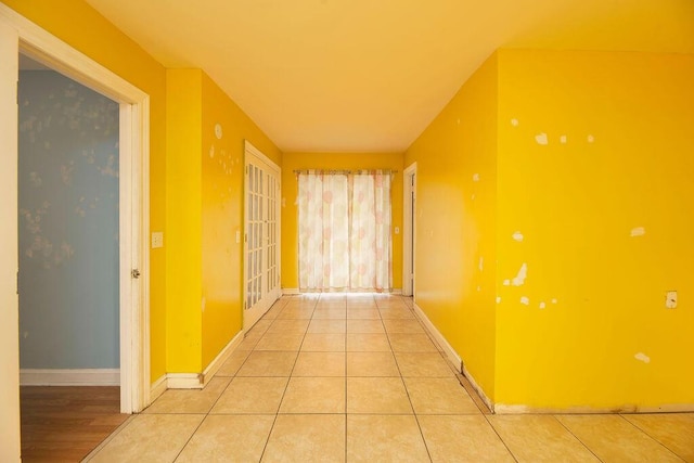 corridor with light tile patterned floors