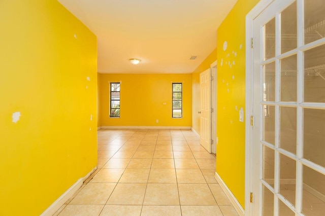 hallway featuring light tile patterned floors