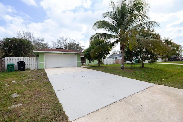 view of front facade with a garage and a front yard