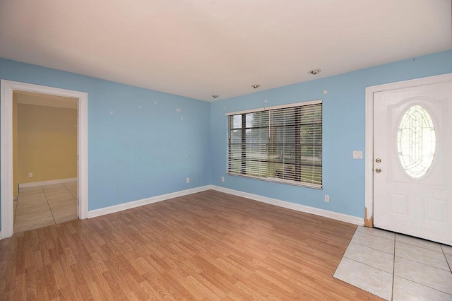 foyer entrance featuring plenty of natural light and light hardwood / wood-style flooring