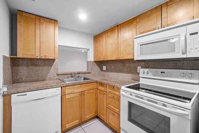 kitchen featuring white appliances, light tile patterned floors, sink, and backsplash