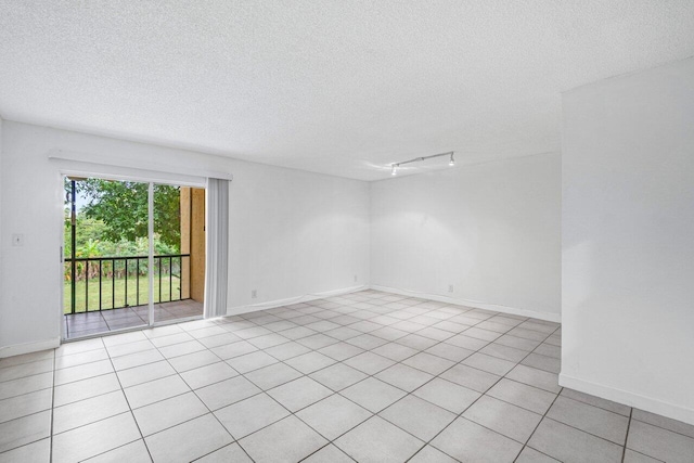 empty room featuring a textured ceiling