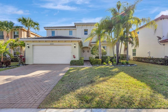 mediterranean / spanish-style house with a front yard