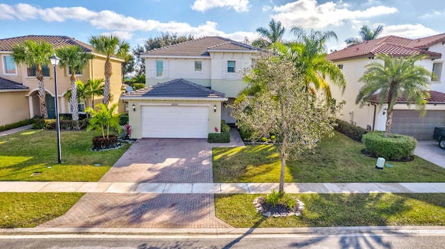 mediterranean / spanish home featuring a front yard