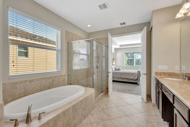 washroom featuring washing machine and clothes dryer and light tile patterned flooring