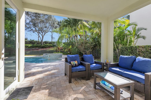 view of patio / terrace featuring an outdoor living space and a pool with hot tub