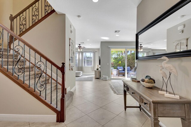 mediterranean / spanish house featuring a garage and a front yard