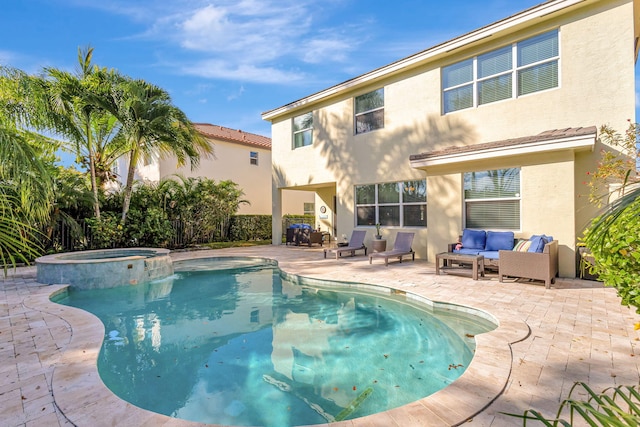 view of pool featuring a patio area, outdoor lounge area, and an in ground hot tub