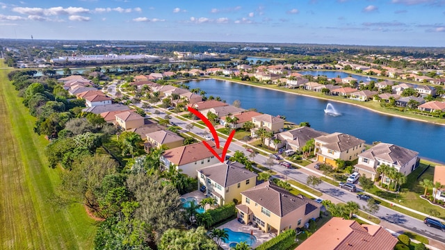 birds eye view of property featuring a water view