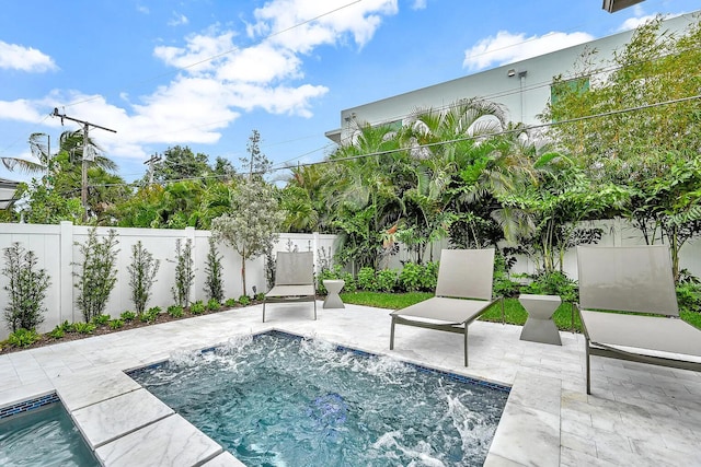 view of swimming pool featuring a patio area