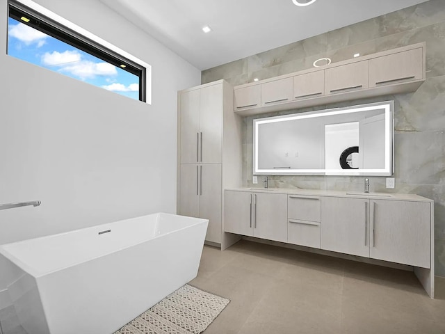 bathroom with vanity, a bathtub, and concrete flooring