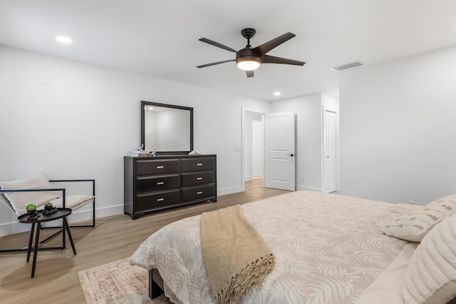 bedroom with recessed lighting, visible vents, light wood-style flooring, and baseboards