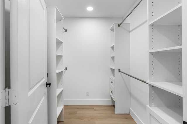 walk in closet featuring light wood-type flooring