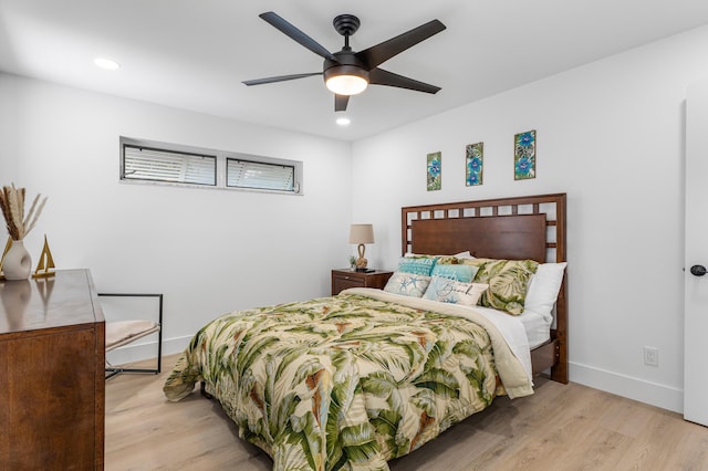 bedroom featuring light wood-type flooring, baseboards, and recessed lighting