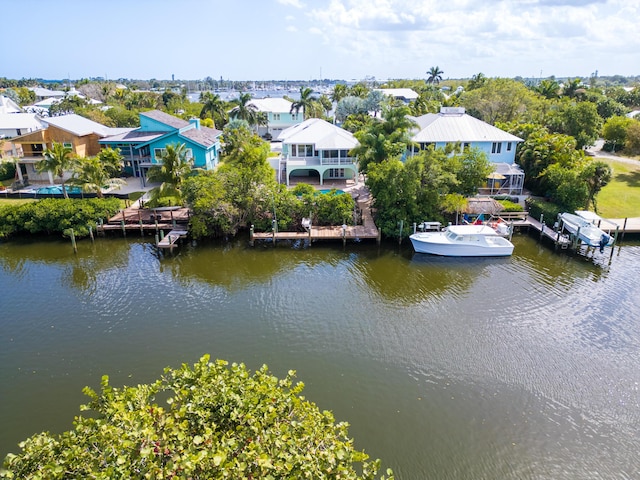 drone / aerial view featuring a residential view and a water view