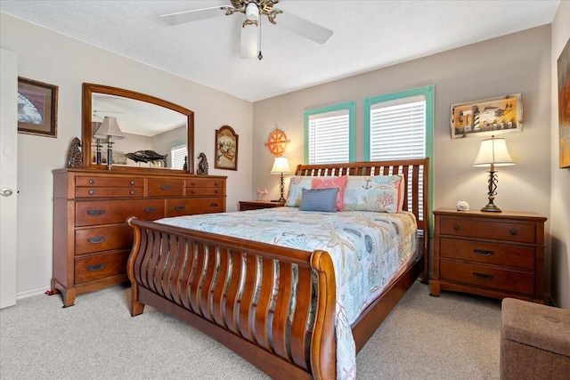 bedroom with light colored carpet and ceiling fan