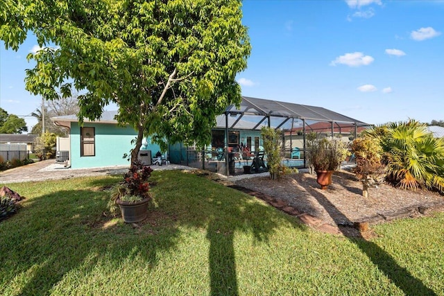 exterior space featuring a lanai, a lawn, and a fenced in pool