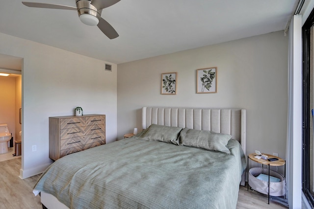 bedroom with ceiling fan and light wood-type flooring