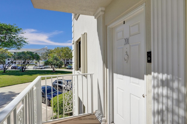 property entrance featuring a yard