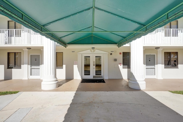 doorway to property featuring a patio and french doors