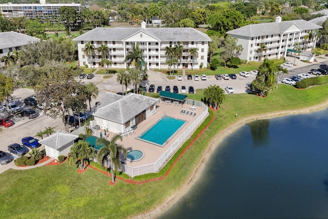 birds eye view of property with a water view