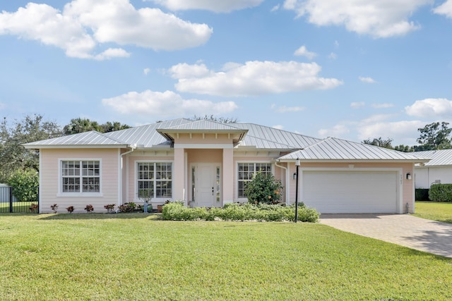 view of front facade featuring a garage and a front yard