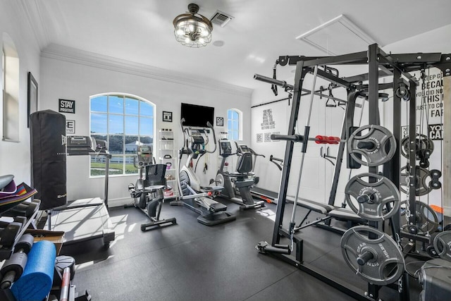 exercise room with ornamental molding