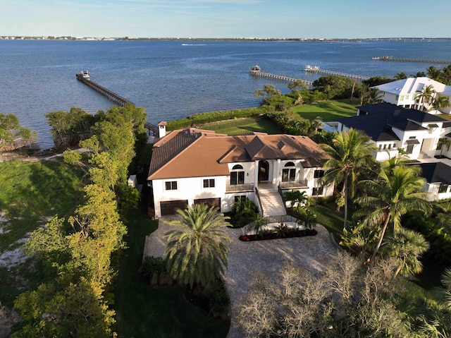 birds eye view of property with a water view