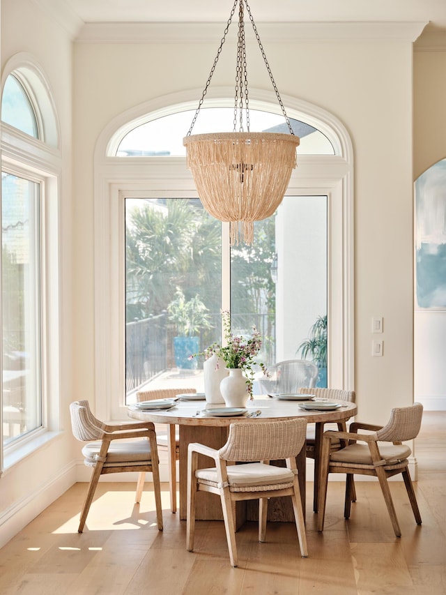 dining room featuring crown molding and wood-type flooring